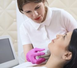 Young woman receiving facial beauty treatment in a spa